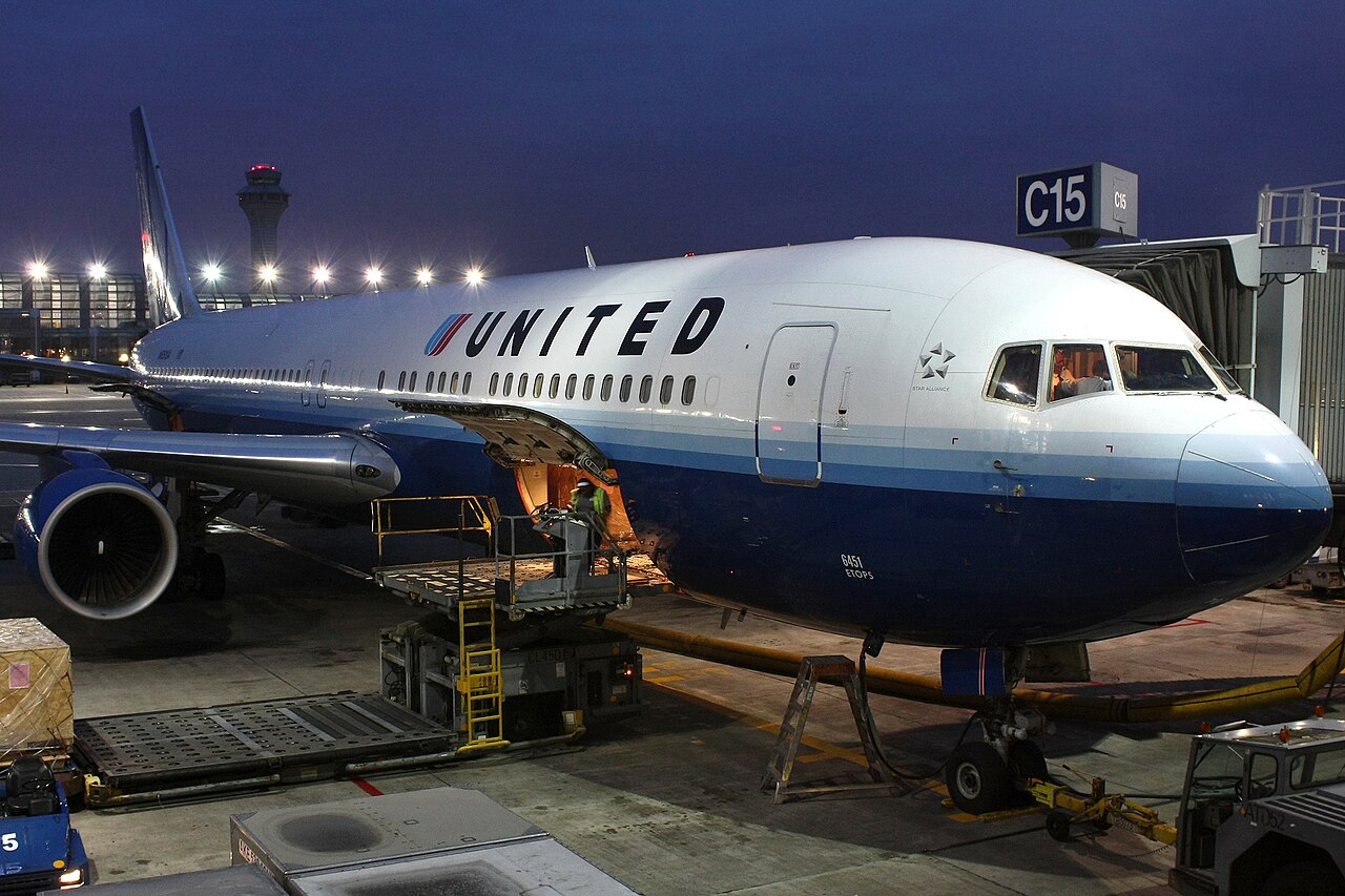 United Airlines Boeing 767-300 being loaded at Chicago O'Hare for European flight.