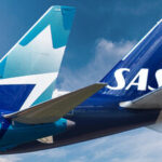 An image of the tails of two airline aircraft, WestJet and SAS