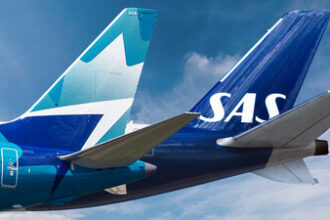 An image of the tails of two airline aircraft, WestJet and SAS