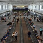 Denver International Airport C Gates. People walking inside the airport