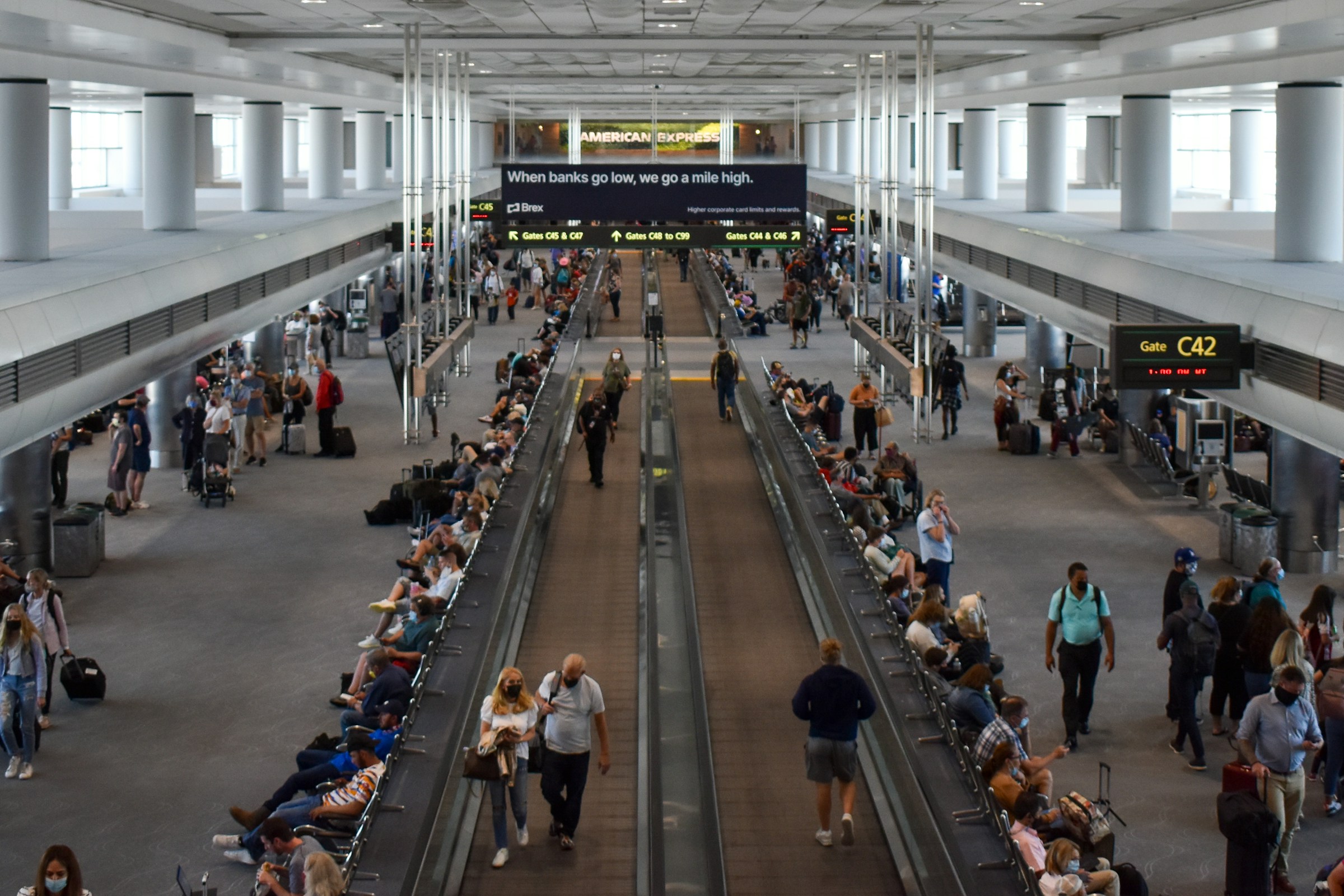 Denver International Airport C Gates. People walking inside the airport