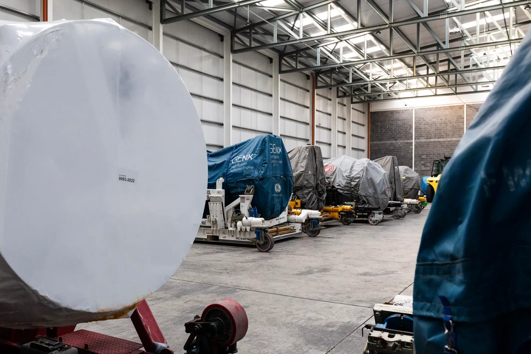 EirTrade Aviation image showing parts of planes in a large warehouse.