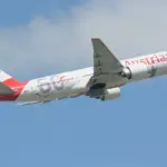 Austrian Airlines Boeing 777-20ER taking off on blue sky