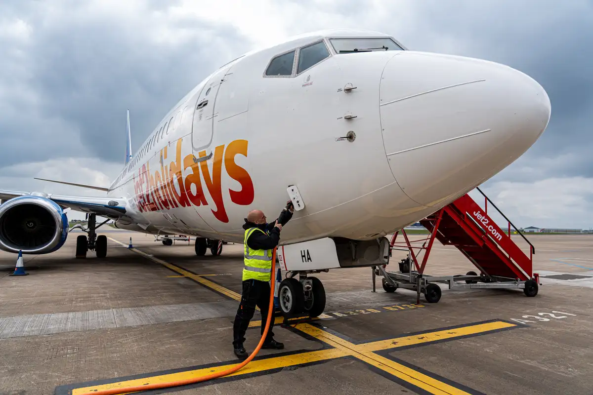 An up-close image of a Jet 2 Holidays aircraft being refuelled on the ground.