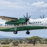 Miracle Air Dash 8 aircraft flying over the Safari.