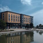 A large building sitting beside a body of water