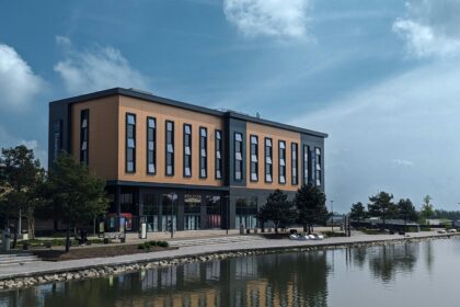 A large building sitting beside a body of water