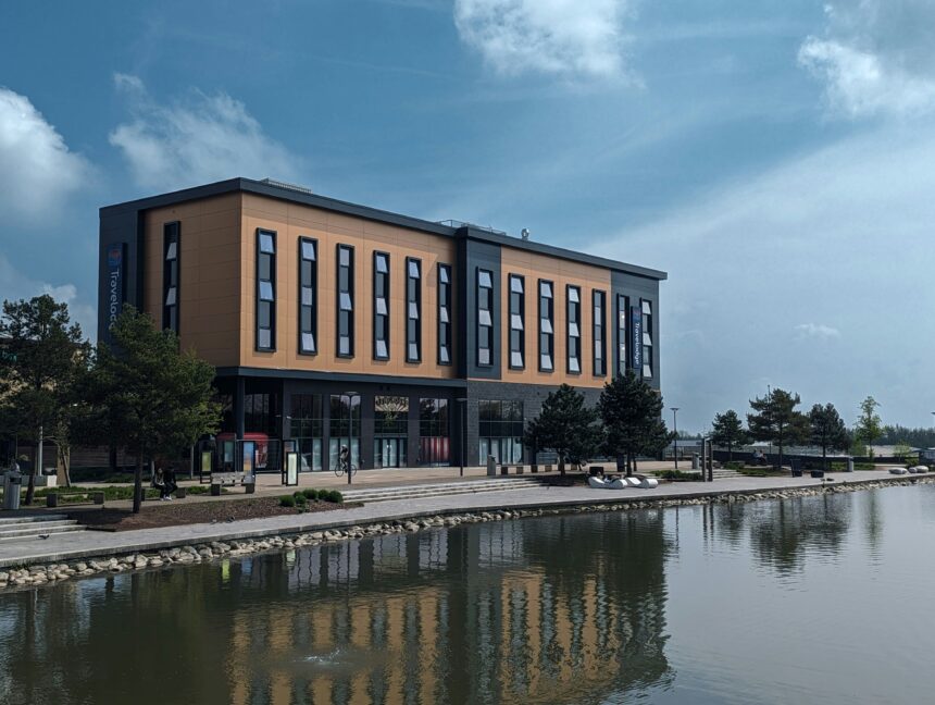 A large building sitting beside a body of water