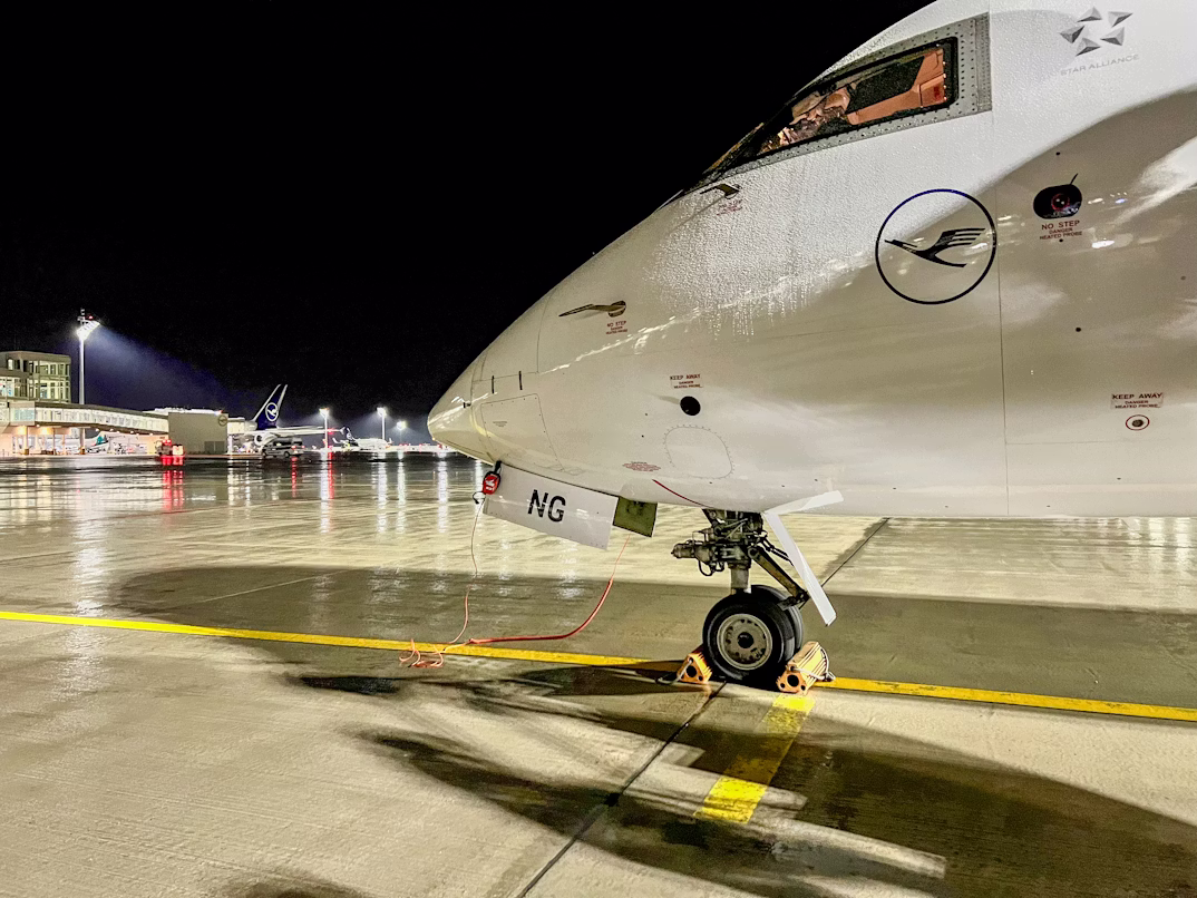 The nose of a Lufthansa CityLine aircraft boarding at Munich Airport