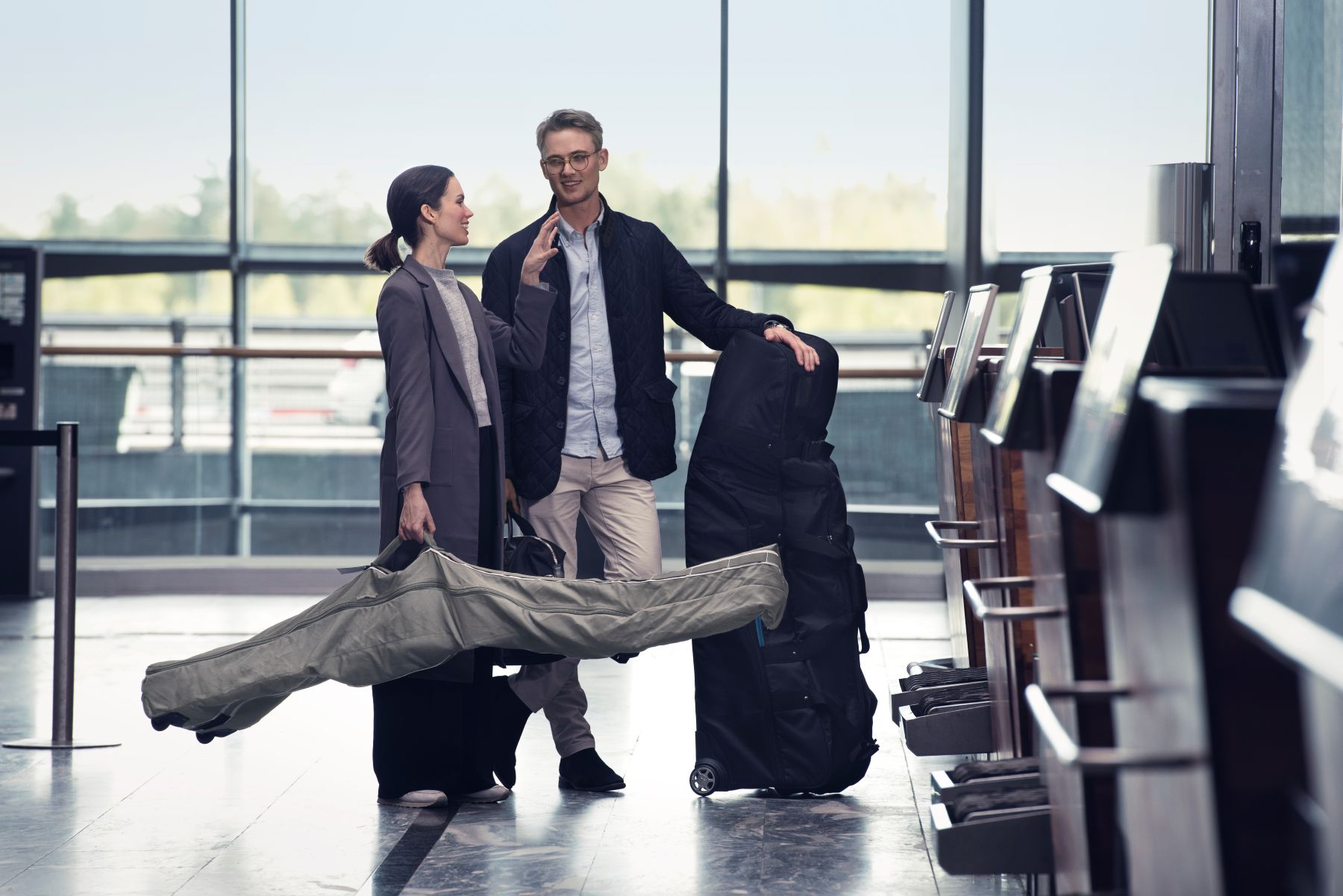 an image of two passengers with their luggage 
