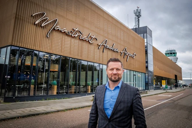 A picture of Dean Boljuncic, Head of Commercial Development at Maastricht Aachen Airport, standing outside the airport building