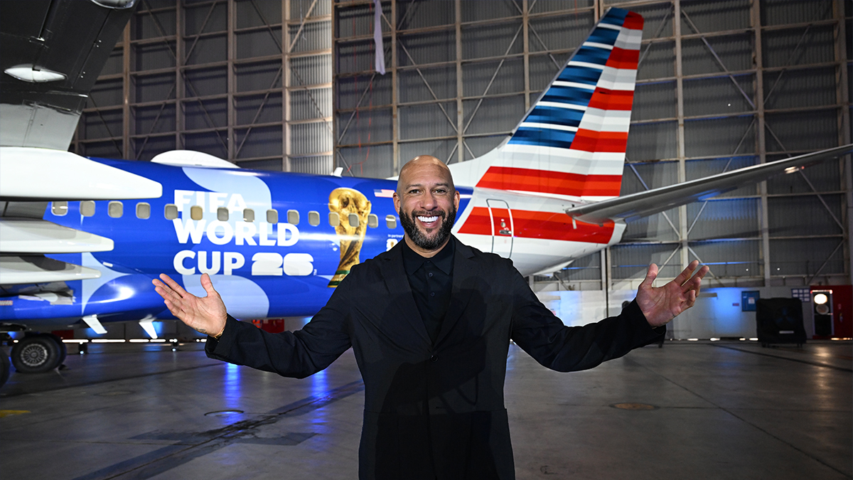 Tim Howard pose in front of American Airlines' FIFA World Cup 26-themed aircraft livery