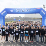 Participants posing for a commemorative photo at the charity event