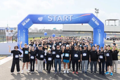 Participants posing for a commemorative photo at the charity event
