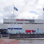 Aberdeen International Airport from the outside parking lot. There is a bus on the left hand side.