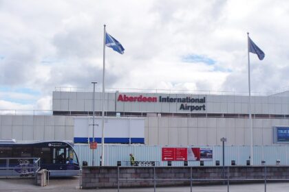 Aberdeen International Airport from the outside parking lot. There is a bus on the left hand side.