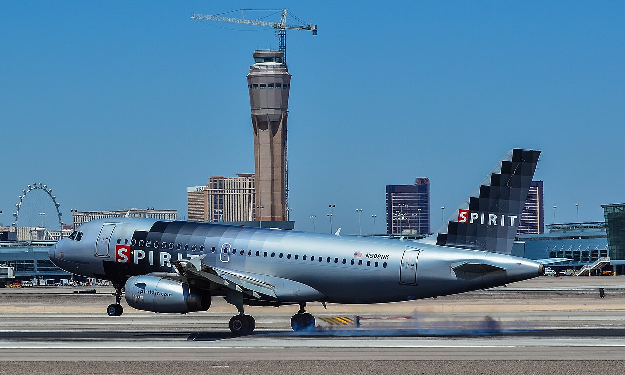 Spirit Airlines A320 at Las Vegas International Airport under a blue sky. Blue livery.