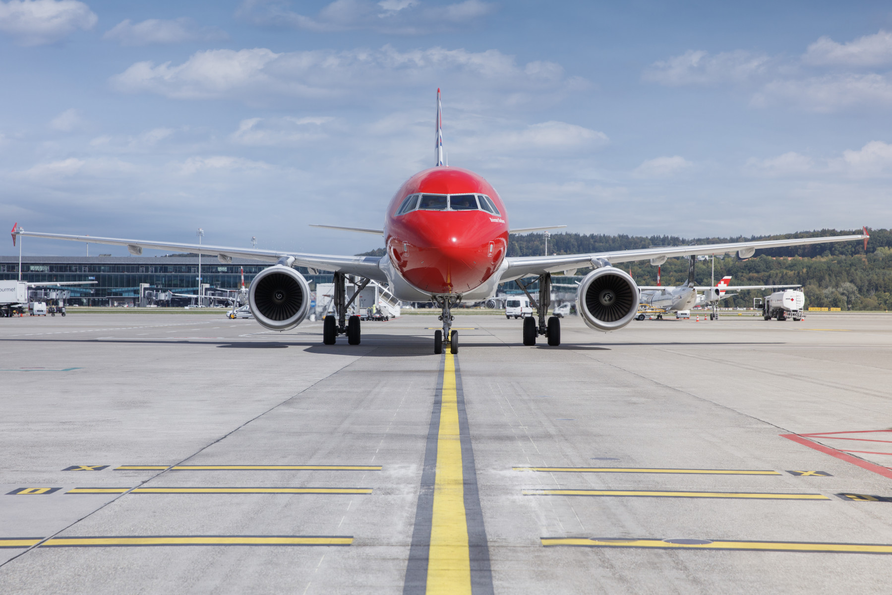 Frontal view of the Edelweiss A320 on the runway.