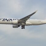Finnair Airbus A350 flying against a clear, blue sky