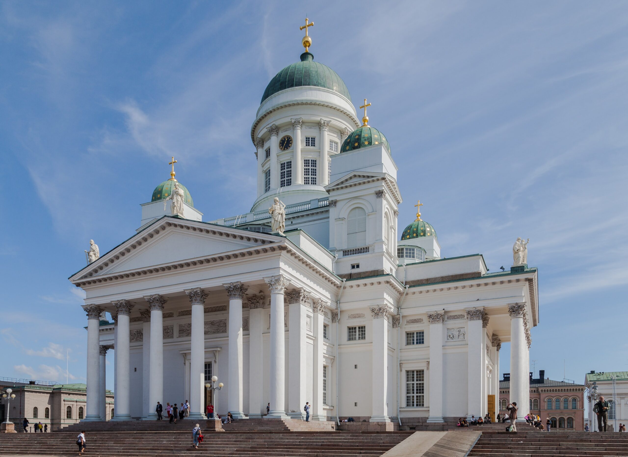 A white building (Helsinki Cathedral) against a clear blue sky 