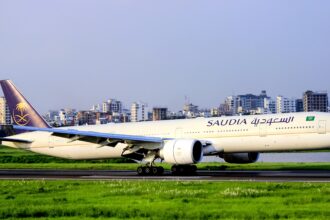 Saudia Airlines Boeing 777 on the runway on a clear day