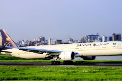 Saudia Airlines Boeing 777 on the runway on a clear day