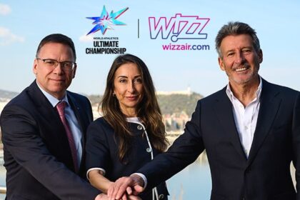 Two men, one woman with their hands in together in front of them, "Wizz Air" and "Ultimate Championship" written behind them.
