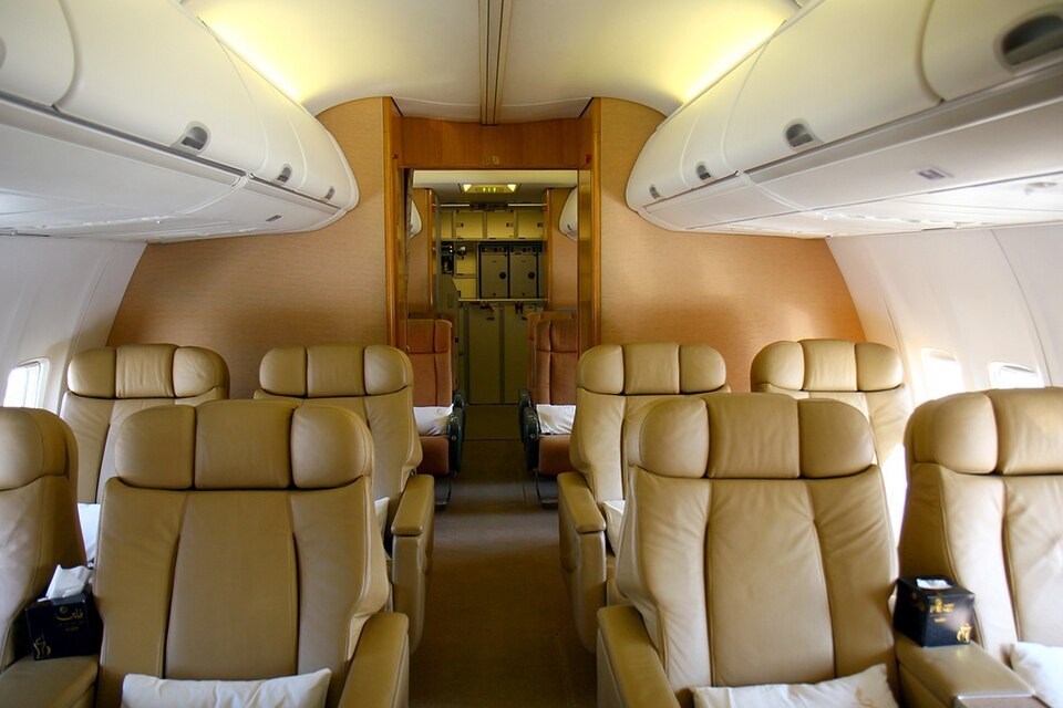 Interior of Boeing 737-7Z5 BBJ, Royal Jet, showing chairs and overhead storage.