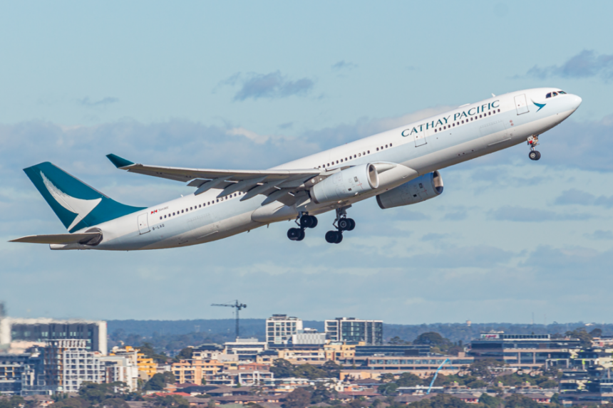 A Cathay Pacific Airbus A330-300 (registration B-LAO) mid-rotation during takeoff from Sydney Airport.