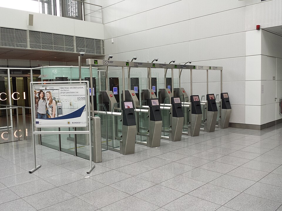 EU border control biometric system check at Munich International Airport.