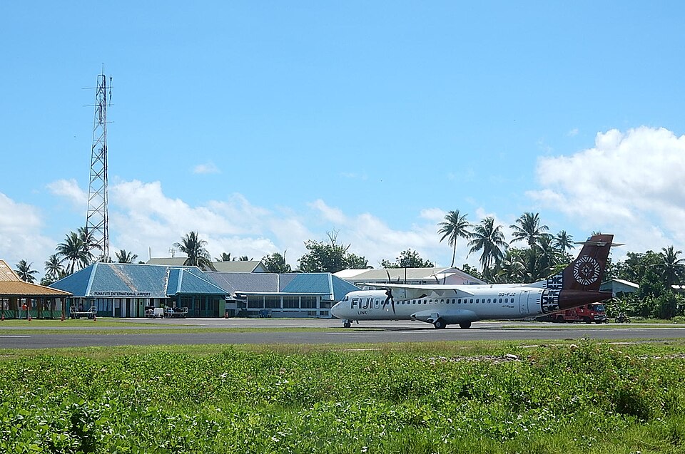Funafuti International Airport in Tuvalu, featuring a Fiji Link aircraft on the runway.