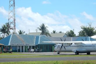 Funafuti International Airport (IATA: FUN, ICAO: NGFU) in Tuvalu. A Fiji Link aircraft is visible on the runway.