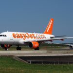 An easyJet Airbus A319 taxis on the runway in this aviation image, highlighting the UK low-cost carrier’s operations and fleet at a European airport.