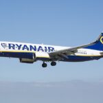 Ryanair Boeing 737-8AS EI-EBX at Leeds Bradford Airport, flying through the blue sky.