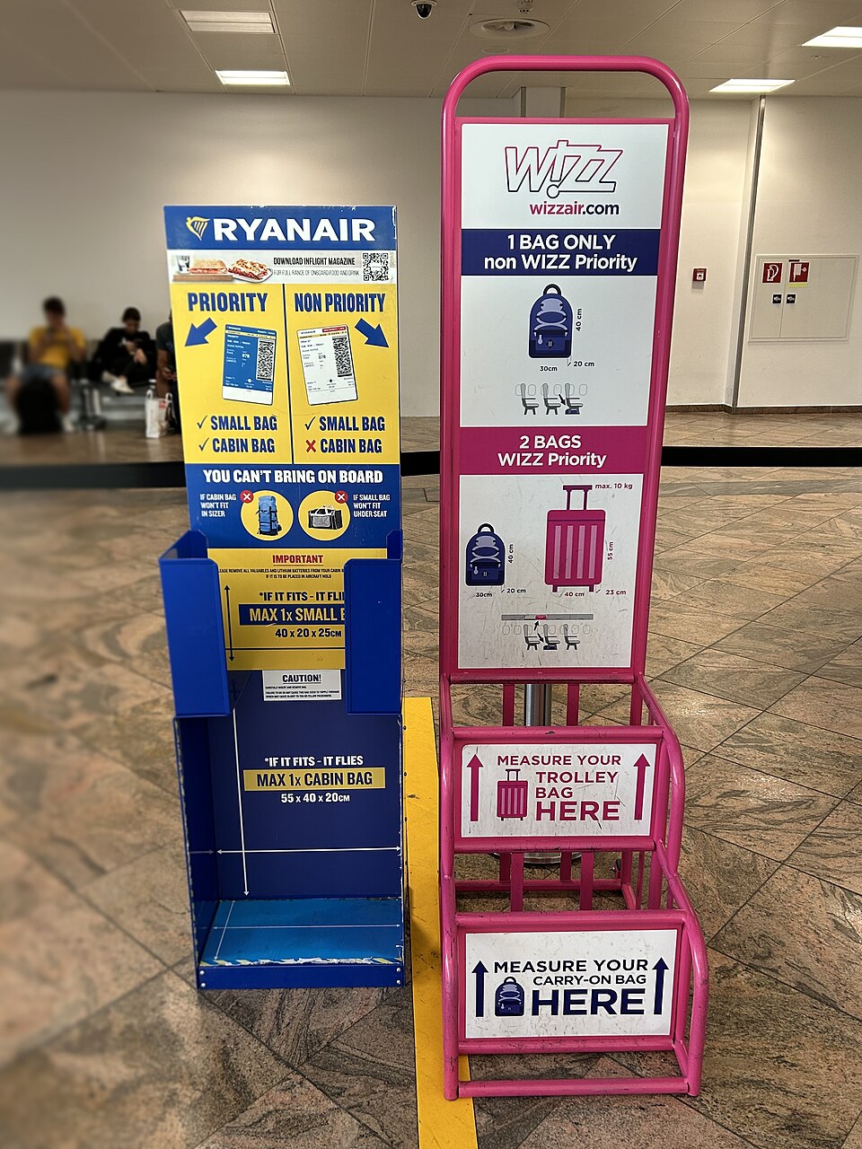 Ryanair and Wizz Air baggage sizers next to each other.