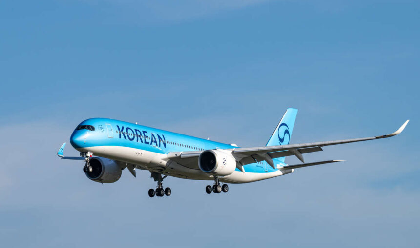 A350 Korean Air aircraft with light blue body and dark blue logo in flight.