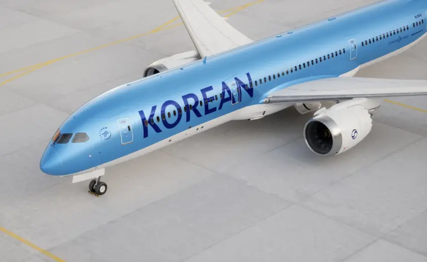 Image of a Korean Air aircraft, a sky blue colour with navy blue lettering and white wings and jets.