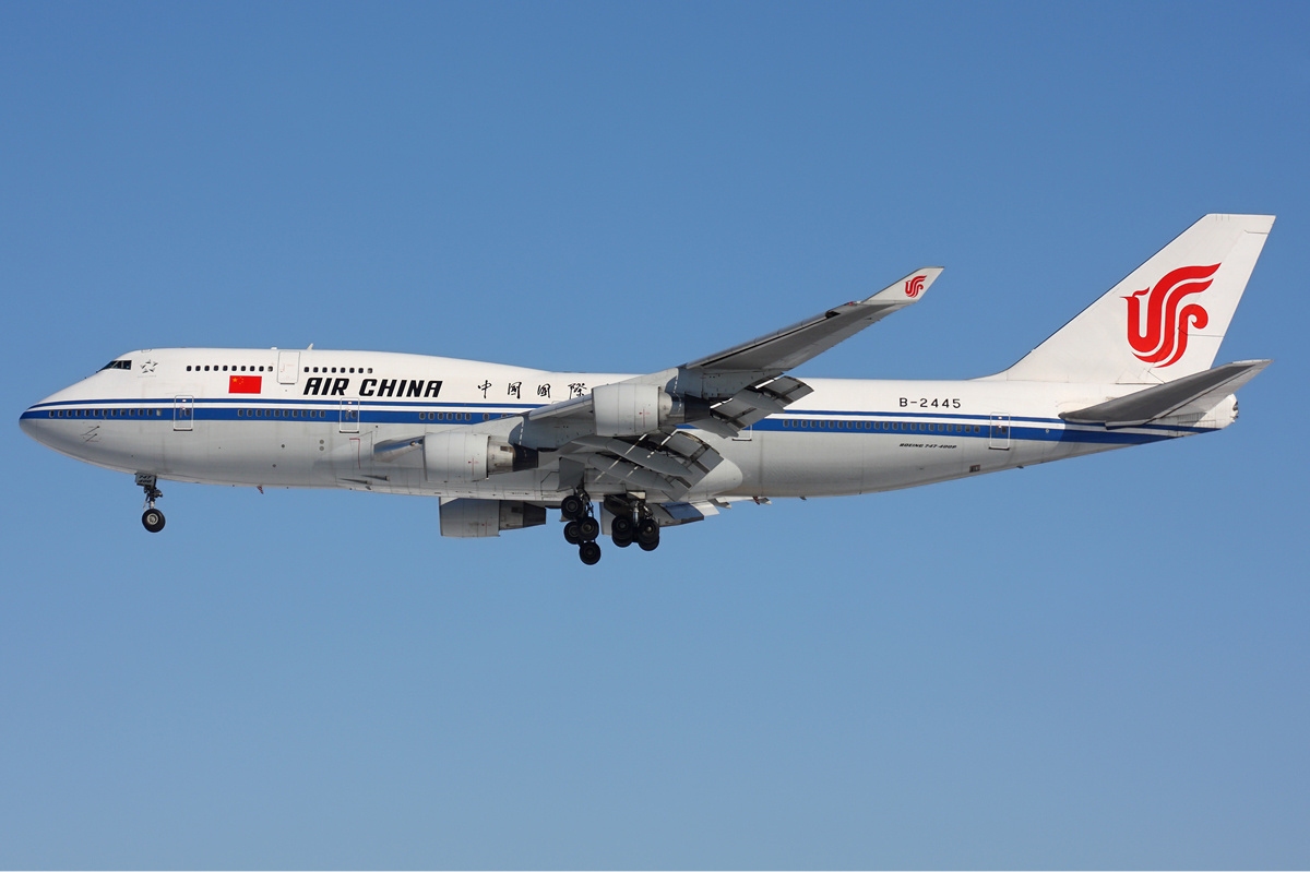Air China Boeing 747-400 flying under a blue sky