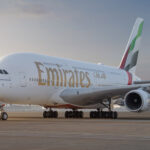 Front side of Emirates Airbus A380 aircraft against the backdrop of Dubai