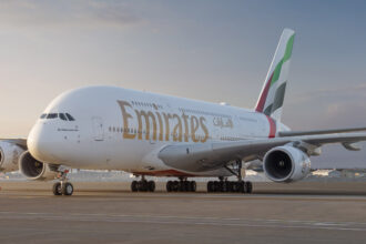 Front side of Emirates Airbus A380 aircraft against the backdrop of Dubai