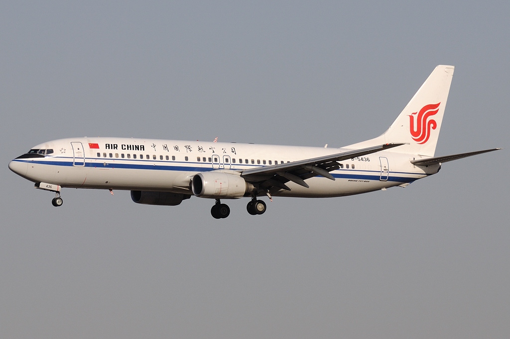 Air China Boeing 737 flying under a grey sky