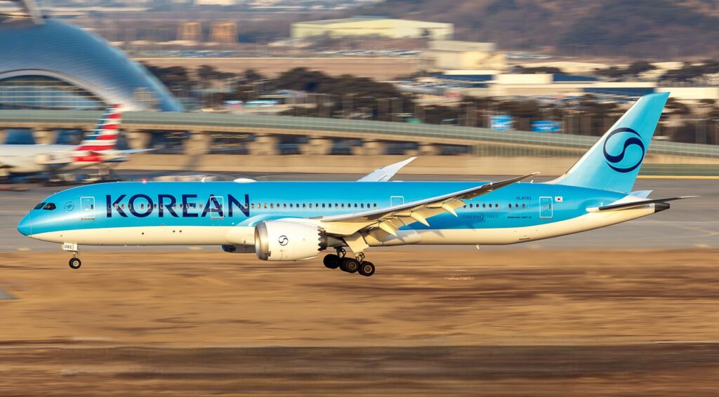 A Korean Air Boeing 787-9 Dreamliner aircraft captured during landing at Taipei International Airport with an American Airlines aircraft in the apron area