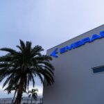 Embraer headquarters in Melbourne Australia with a palm tree