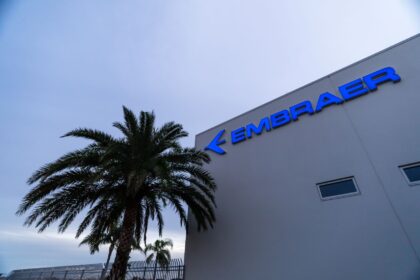 Embraer headquarters in Melbourne Australia with a palm tree
