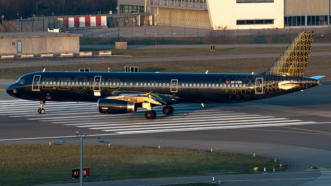 beOnd A321 aircraft registered 8Q-FBB captured during the golden hour in its distinctive all black and gold livery at Zurich International Airport