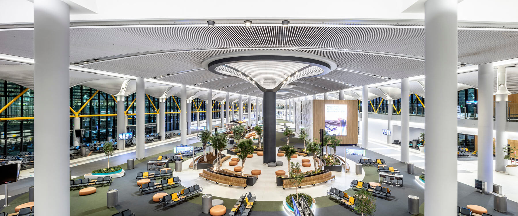 Aerial view of iGA Istanbul Airport, featuring a circular waiting lounge area