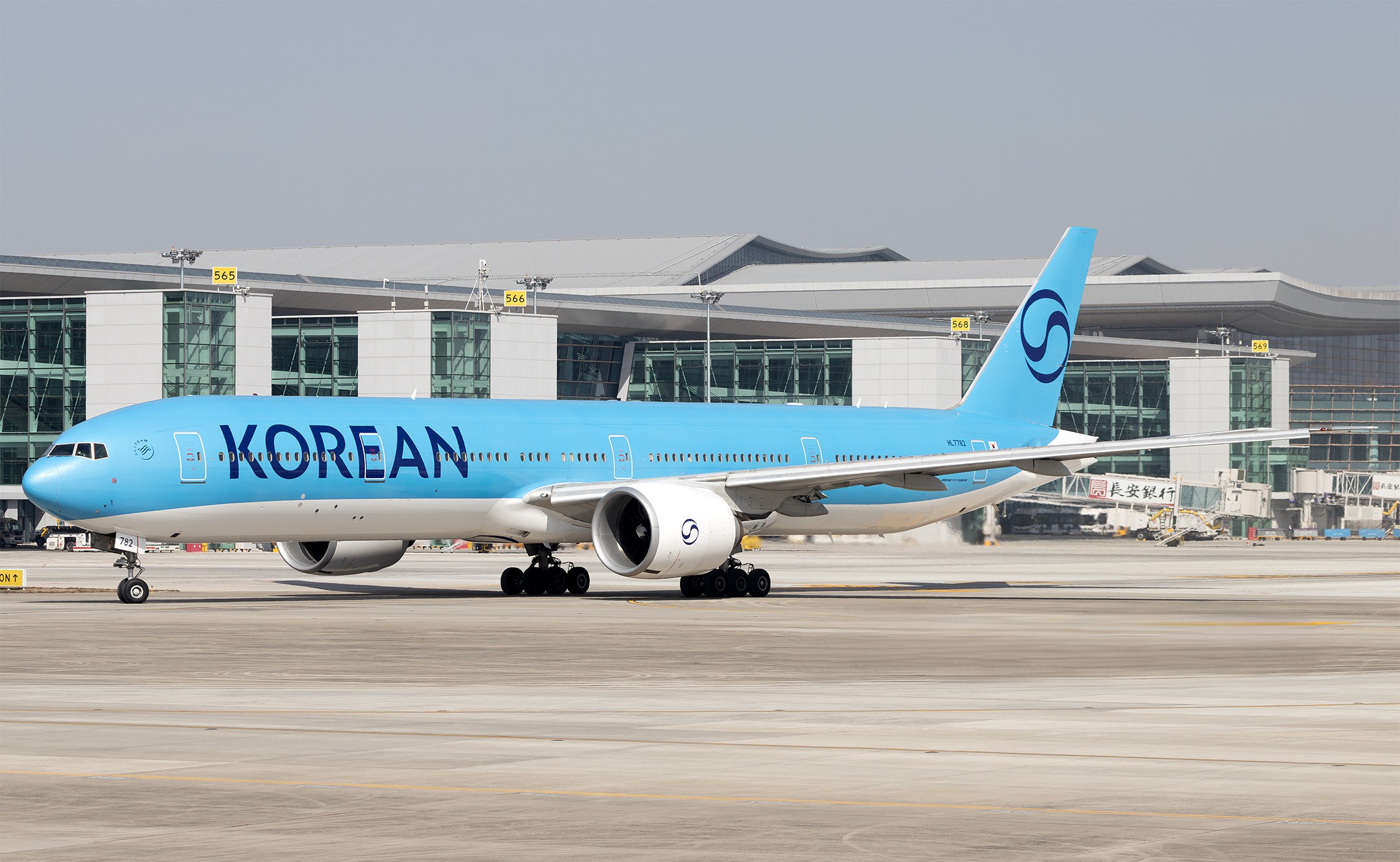 A Korean Air Boeing 777-300ER aircraft with its all new blue livery at the apron area of Xi'an Xianyang International Airport in China