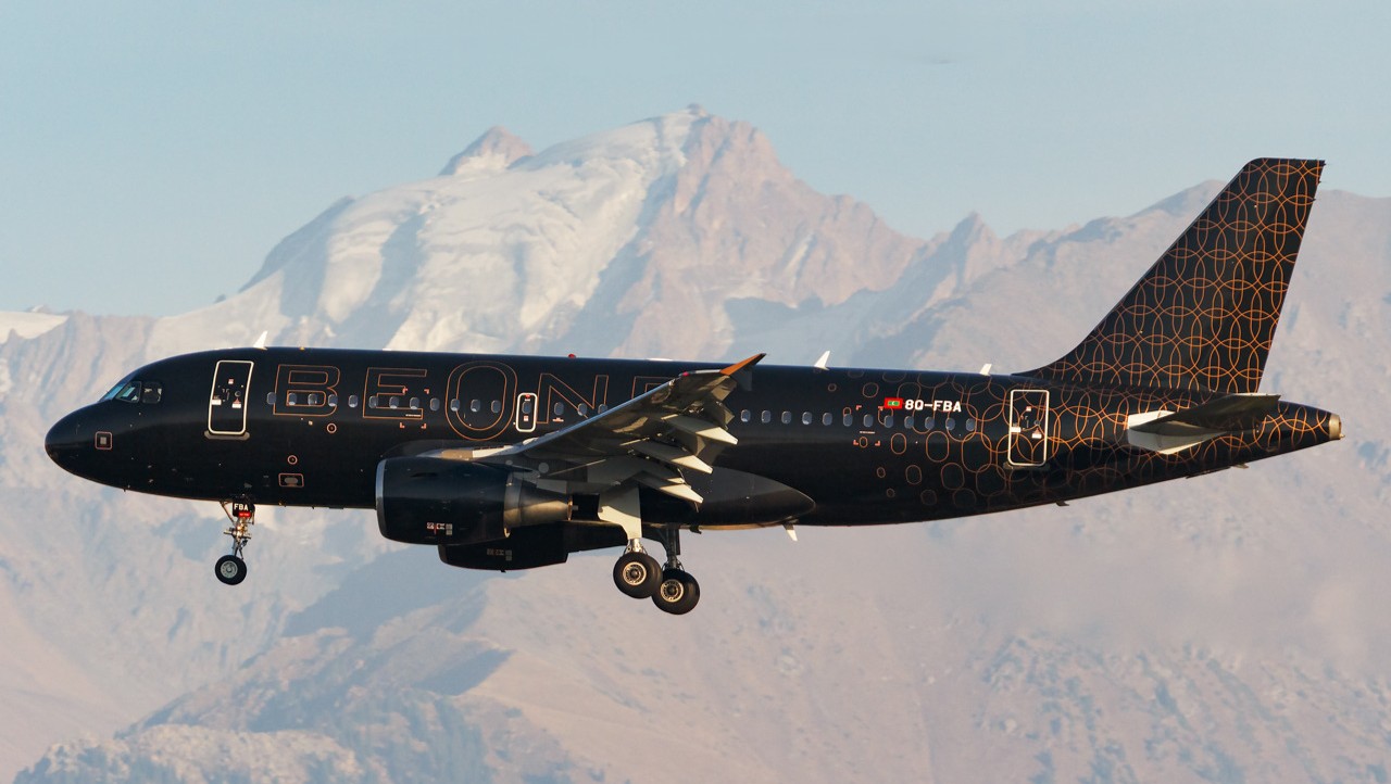 Beond A319 aircraft registered 8Q-FBA captured during landing on the backdrop of a mountain