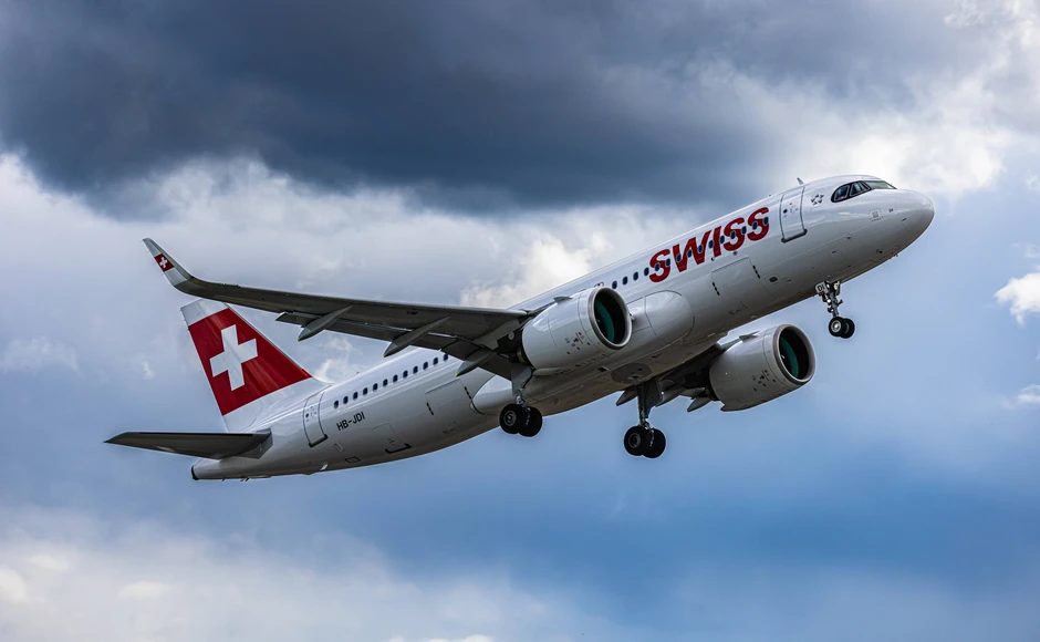 Swiss flight makes emergency landing, above mountains, slightly foggy landscape
