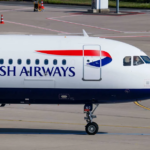 A large white British Airways jetliner waiting on the tarmac at an airport